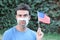 Protestor with broken surgical mask in the USA