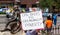 Protestor Holds Sign Criticizing the Columbus Police Department