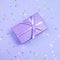 Proton Purple gift box with ribbon and rainbow holographic stars confetti on violet pastel background