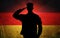 Proud german soldier on german flag background