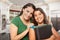 Proud Hispanic Mother and Daughter In Kitchen at Home Ready for