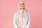 Proud muslim girl in hijab, isolated on pink