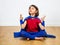 Proud superhero child practicing yoga and meditation for zen humour