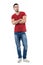 Proud young casual trendy man in red t-shirt with crossed hands looking at camera