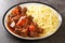 Provencal Beef Stew Daube served with noodles closeup in the plate. Horizontal