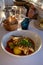 Provence cuisine, filet of seabass white fish served with potatoes, tomatoes and .Bouillabaisse jus in French restaurant