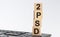 PSD2 - acronym on wooden blocks with letters, Payment Service Directive 2 payment and commerce concept, front view on white