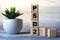 PSD2 - acronym on wooden cubes on a light background with a cactus