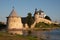 Pskov Kremlin view from river Pskova creek. Towers, wall and Trinity cathedral on background