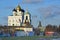 Pskov, Russia, December, 31, 2017. People walking near ancient Pskov kremlin and Svyato-Troitsky cathedral