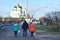 Pskov, Russia, December, 31, 2017. People walking near ancient Pskov kremlin and Svyato-Troitsky cathedral