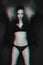 Psychedelic black and white portrait of girl in lingerie with glitch effect