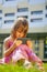 Psychological image of cute little girl addicted to likes. Close up portrait of nervous child with mobile smart phone. Emotional