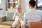 Psychologist giving tissues to senior woman client