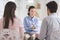 Psychologist helping to couple in her consulting room