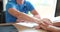 Psychologist holding hands of female patient and providing professional psychological assistance closeup