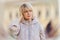 Psychology and mental health. Portrait of Caucasian adult woman holding at her head. Defocused twisted background