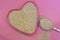 Psyllium in the shape of a heart on a pink background, top view. Super food psyllium seeds, keto diet ingredient