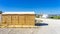 public bathrooms made of recycled wood chipboard for men, women and the disabled.  Sinks for washing hands outside the house