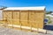 public bathrooms made of recycled wood chipboard for men, women and the disabled.  Sinks for washing hands outside the house