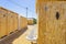 public bathrooms made of recycled wood chipboard for men, women and the disabled.  Sinks for washing hands outside the house