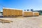 public bathrooms made of recycled wood chipboard for men, women and the disabled.  Sinks for washing hands outside the house