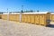 public bathrooms made of recycled wood chipboard for men, women and the disabled.  Sinks for washing hands outside the house