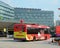 Public commuter buses at a busy bus terminal