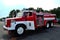 Public demonstration of a historic fire truck from the 20th century in the form of a fire tank