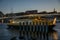 Public ferry and a bike bridge behind in Copenhagen Harbor. Denmark