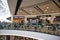 Public food court eating area inside shopping mall centre