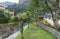 Public garden and mountain stream. Swiss