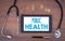 Public Health. Tablet device on a wooden table