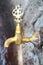 Public metal yellow faucet fountain