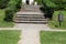 Public park vintage retro improvised steps made from dilapidated old cracked wooden boards filled with small grain gravel