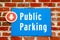 Public Parking Sign on Red Brick