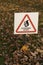 Public sign with a squirrel silhouette and an inscription in Russian `Caution of squirrels!`