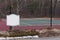 Public Tennis court and around court view form inside fence. Mock up for sign