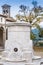 Public water fountain in the square of the Collegiate in Castiglione Fiorentino