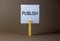 Publish symbol. White paper with the word `Publish`, clip on wooden clothespin. Beautiful grey background. Business and publish