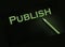 Publish word printed in yellow on black paper. Publishing business concept