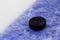 Puck on ice hockey rink surface, sport background