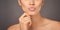 Pucker and pout. Closeup studio shot of a woman with gorgeous glossy lips against a gray background.