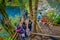 PUCON, CHILE - SEPTEMBER, 23, 2018: Above view of tourists walking close to the waterfalls with some wooden fences at