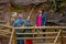 PUCON, CHILE - SEPTEMBER, 23, 2018: Outdoor view of unidentified people walking close to the waterfalls with a wooden