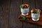 Pudding, with Chia seeds and berries, in glasses, healthy breakfast on a wooden table, horizontal, no people,