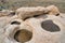 Puddle of water on holes from erosion on rocks at Joshua Tree National Park