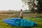 puddleboard. a surfer stands with a board and a paddle on the rpssvet