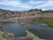 puddles of water created from the pits of the former stone mining