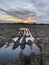 Puddles of water reflecting sunset